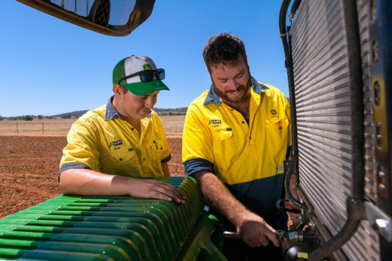 Hutcheon and Pearce mechanics inspect a harvester